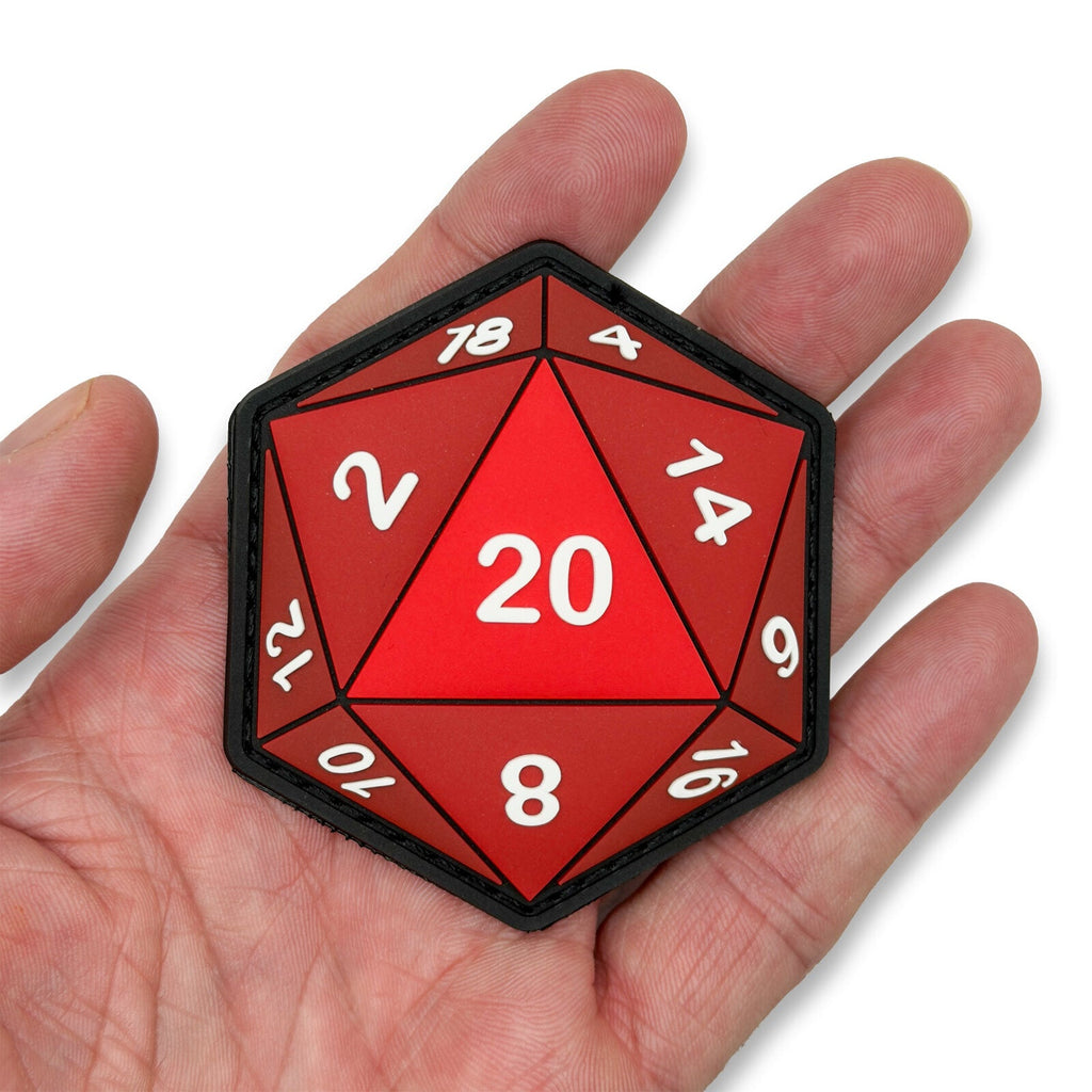 Glow in the dark D20 patch held in hand for scale by Patch Fiend
