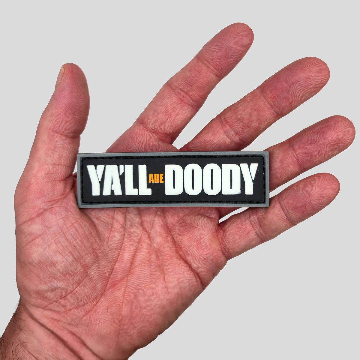 "Ya'll Are Doody" PVC Morale Patch, in hand