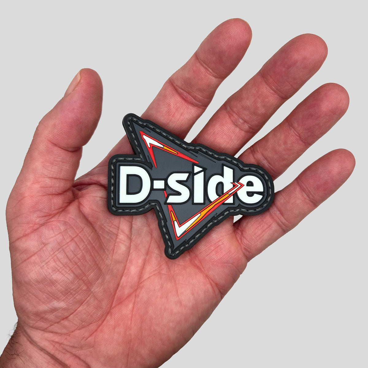 D-Side Paintball Player PVC Morale Patch, SWAGR, in hand
