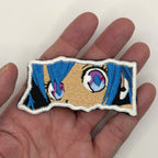 Virtual Diva Eyes embroidered patch held in hand for size, by FOTB Patches