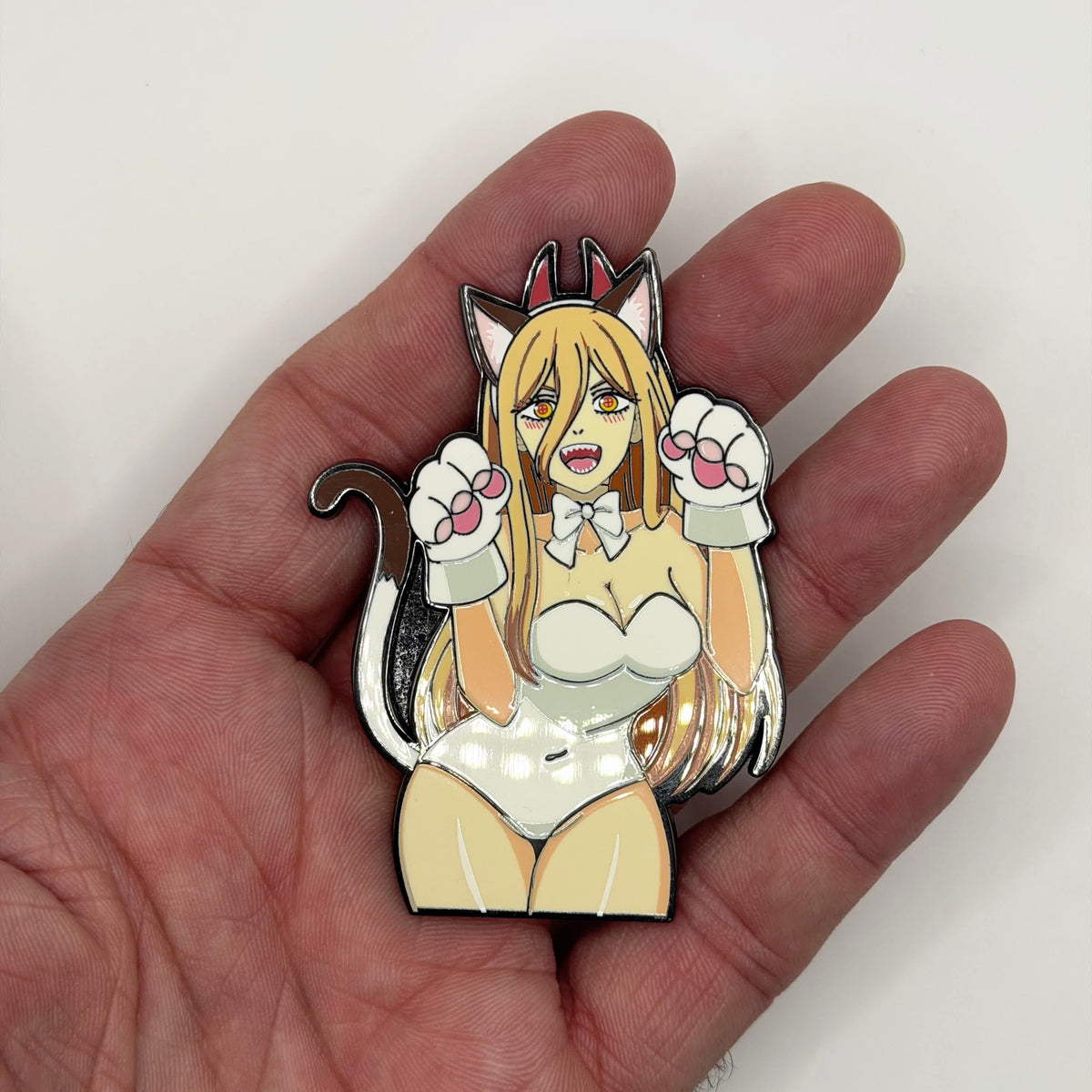 Power cat girl metal patch held in hand for size, by FOTB Patches