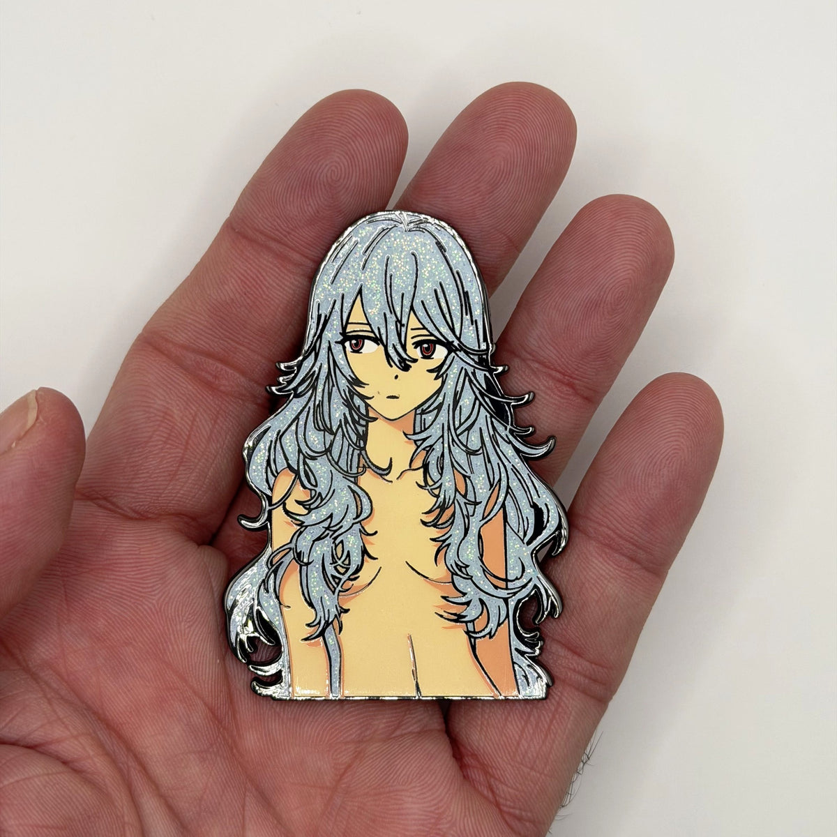 First Child sparkle metal patch held in hand for size, by FOTB Patches
