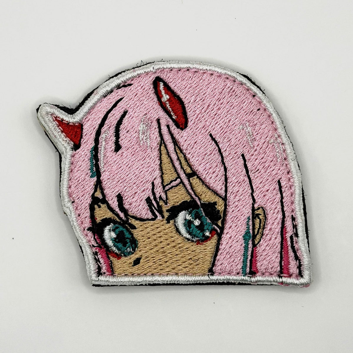 Pink-haired horned anime girl peeker embroidered patch by FOTB Patches