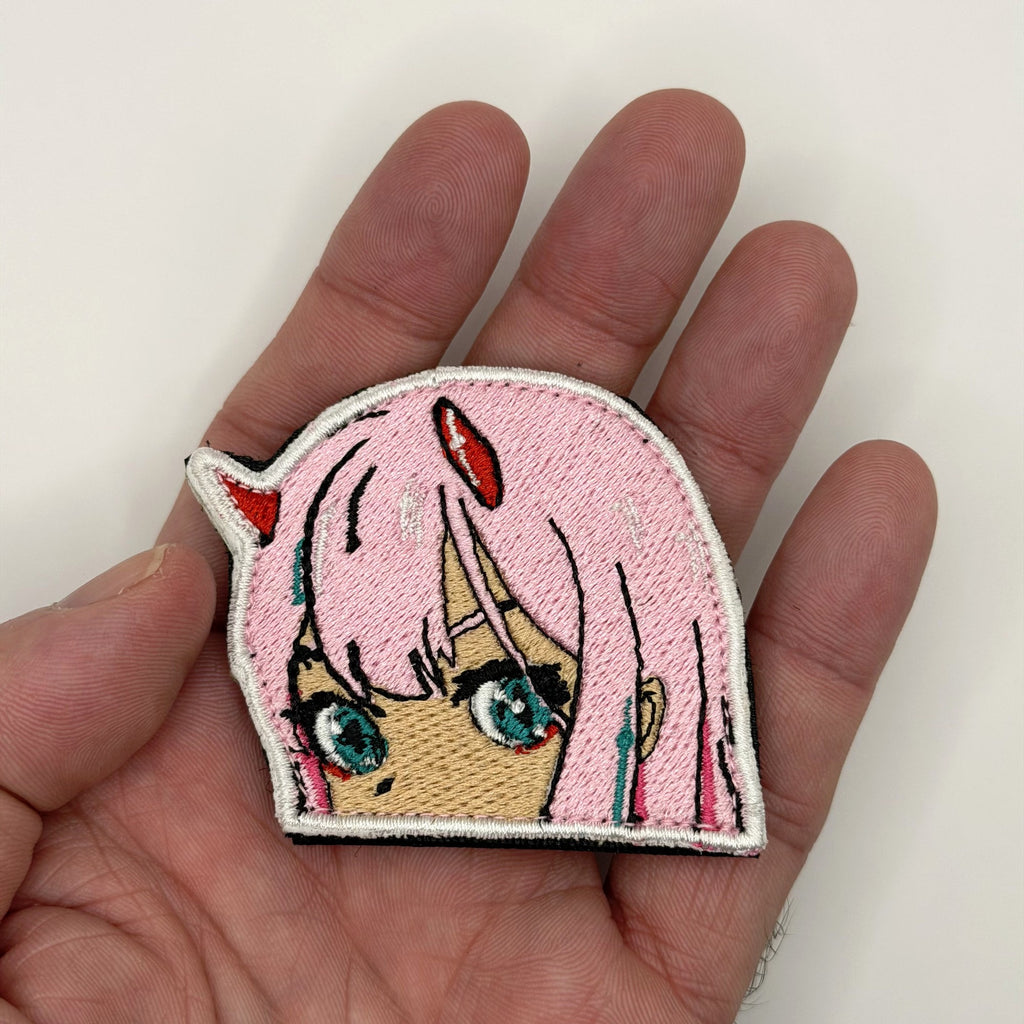 Horned Darling peeker embroidered patch held in hand for size, by FOTB Patches