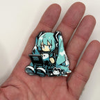 Virtual Diva laptop chibi metal patch held in hand for size, by FOTB Patches