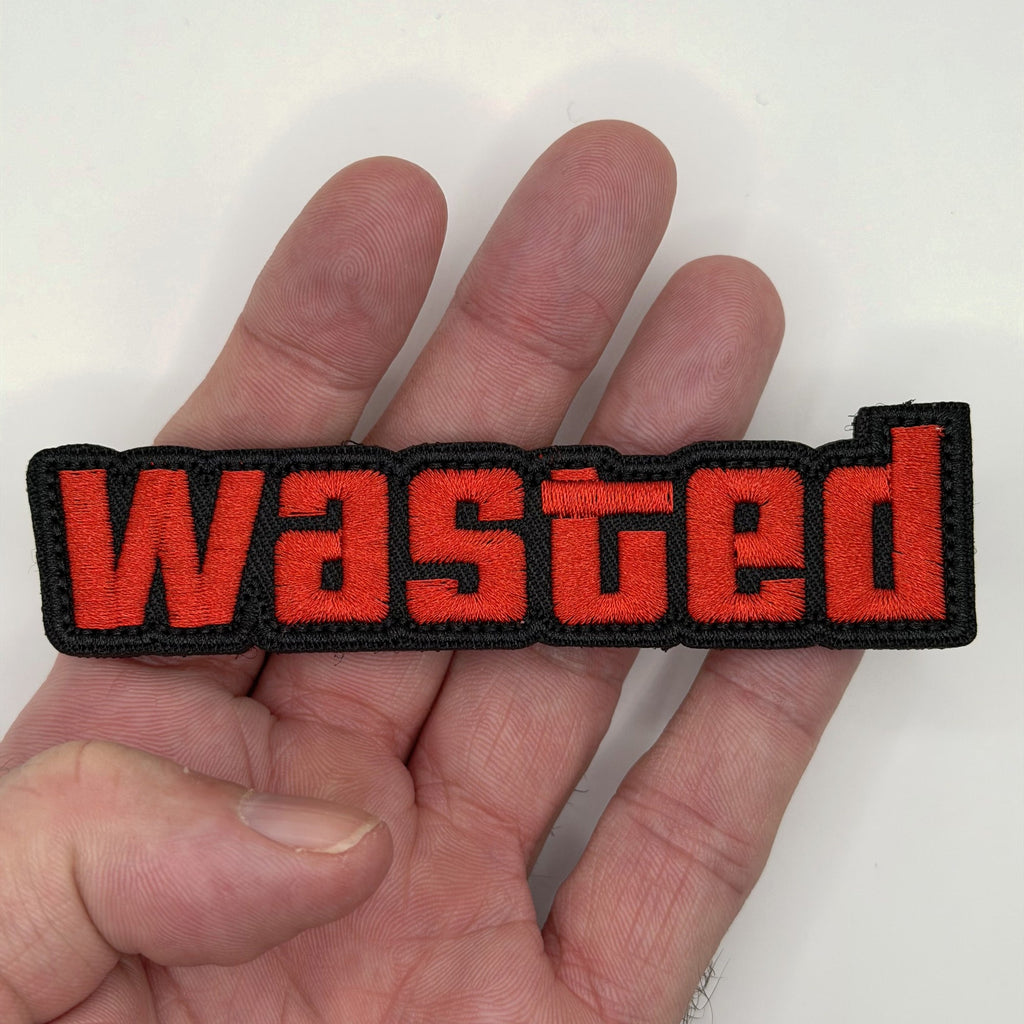 Wasted embroidered patch held in hand for size, by FOTB Patches