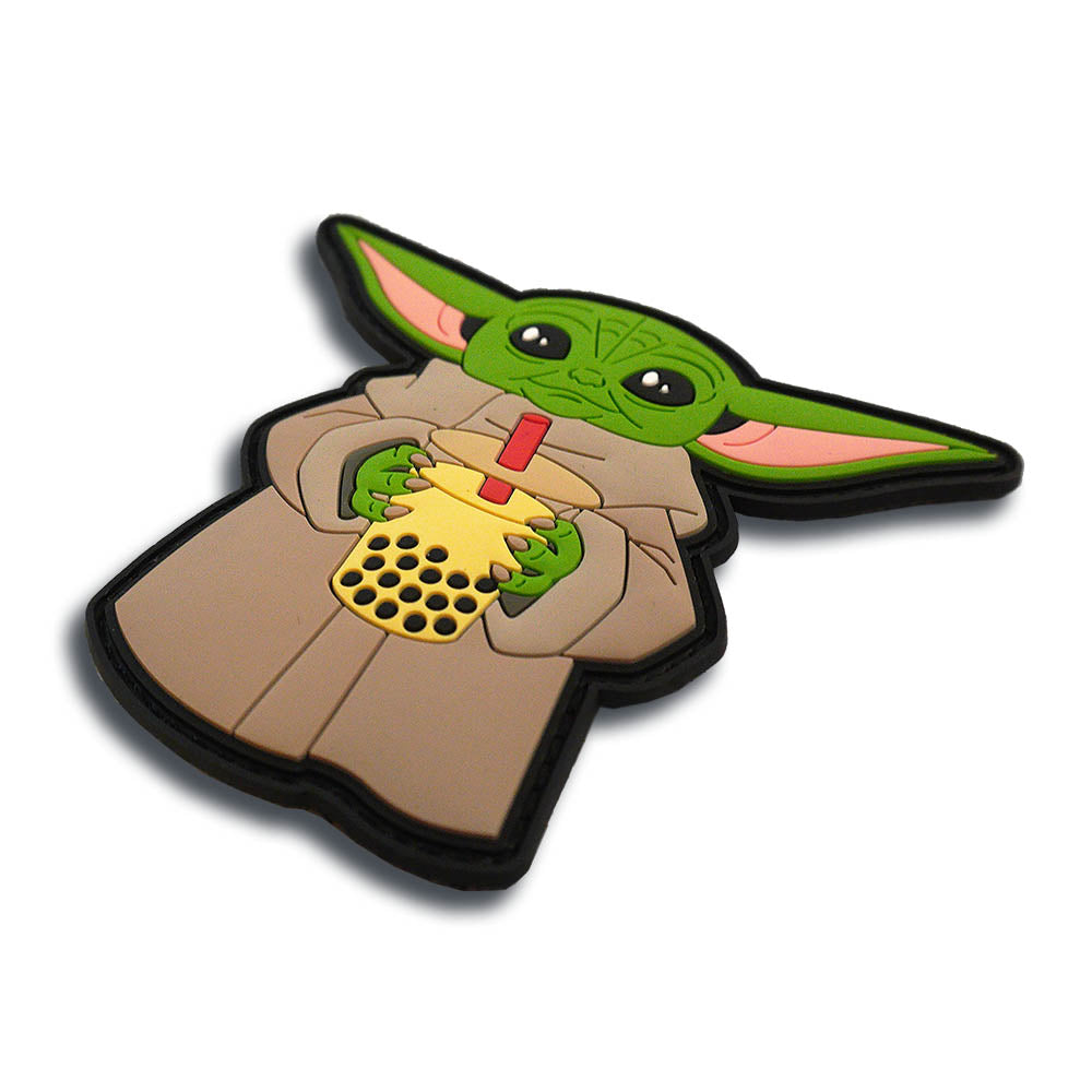 Slurrrp baby alien boba patch at a three-quarter angle, showing the raised 3D molded PVC and black border.